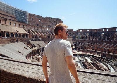 Rear view of man standing against sky