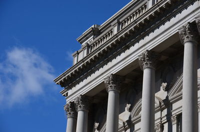 Low angle view of building against blue sky