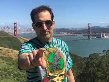 Portrait of man wearing sunglasses against sky