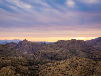 Scenic view of mountains against cloudy sky