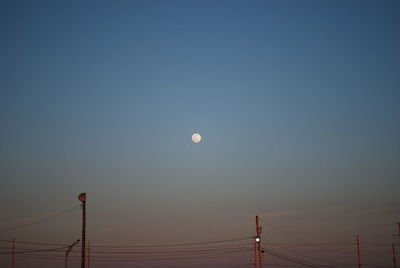 Low angle view of moon against clear sky