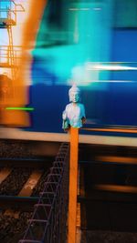 Blurred motion of train at railroad station