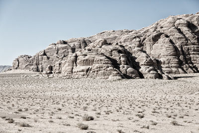 Rock formations in desert against clear sky