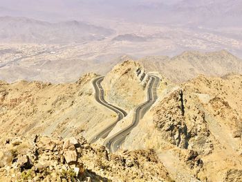 High angle view of land against mountain range in hada-taif road