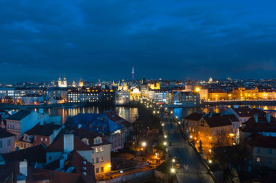 High angle view of illuminated buildings in city at night