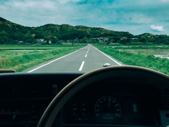 Road passing through field