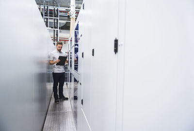 Man examining the system in factory
