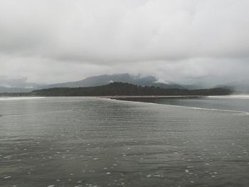 View of lake against cloudy sky