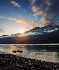 Scenic view of lake against sky during sunset