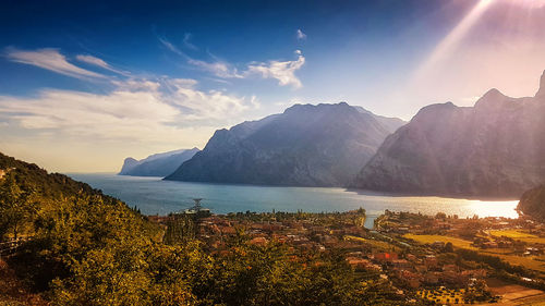 Panoramic view of lake garda against sky during sunset