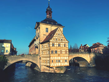 Bamberg - arch bridge over river against buildings - old town hall