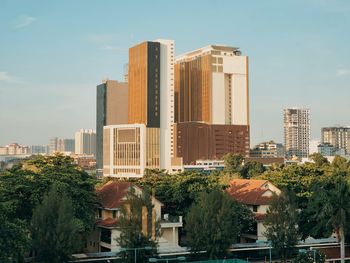 Buildings in city against sky