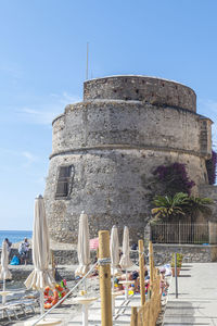 Built structure in sea against sky