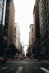 Low angle view of city street against sky