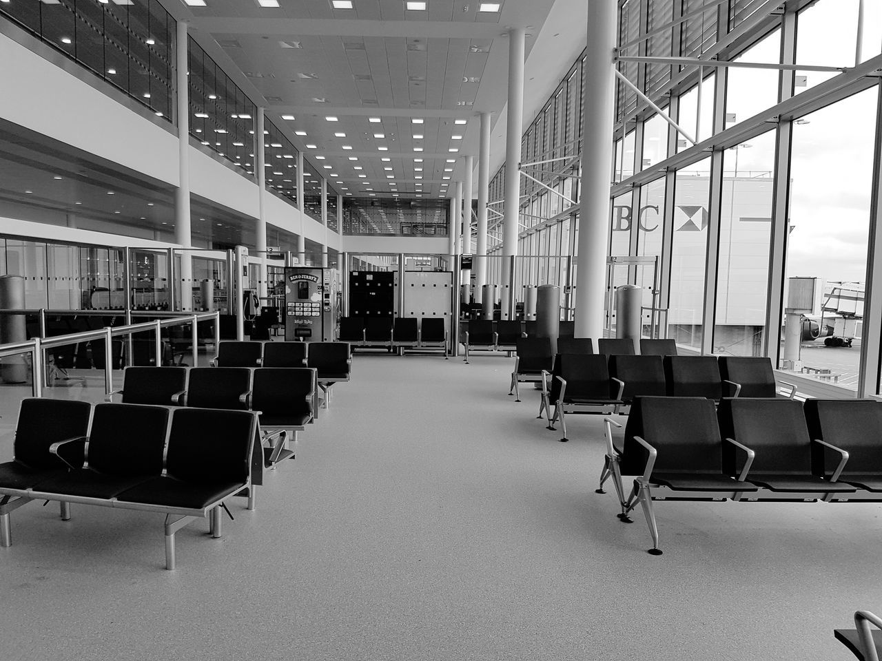 chair, indoors, empty, in a row, seat, education, architecture, desk, built structure, no people, vehicle seat, neat, lecture hall, day