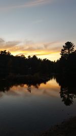 Scenic view of lake at sunset