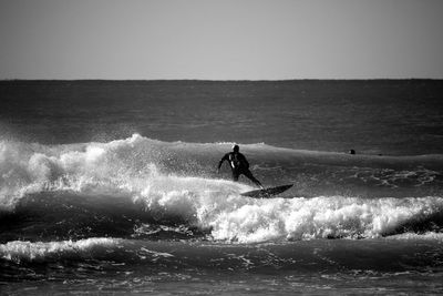 Man surfing on sea waves