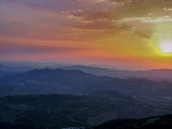 Scenic view of landscape against sky during sunset