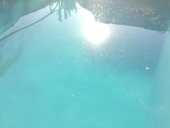 Low section of swimming pool against blue sky