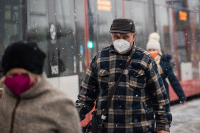 Portrait of people in city during winter