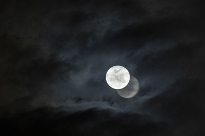 Low angle view of moon against sky