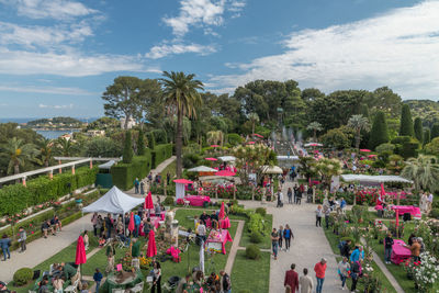 High angle view of people by plants against sky