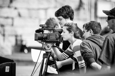 Woman photographing through camera