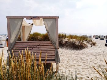 Built structure on beach against sky