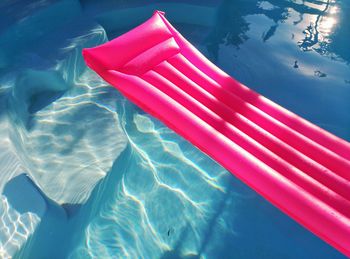 High angle view of pool raft on swimming pool