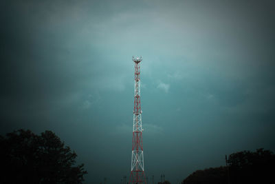 Low angle view of communications tower against sky