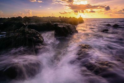 Scenic view of sea against sky during sunset