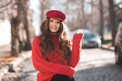 Portrait of pregnant woman standing on street