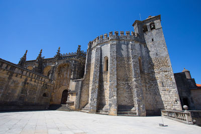 Low angle view of historical building against blue sky