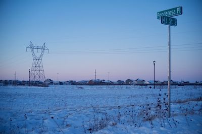 Scenic view of a field and a village in winter 