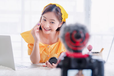 Portrait of a girl sitting on table