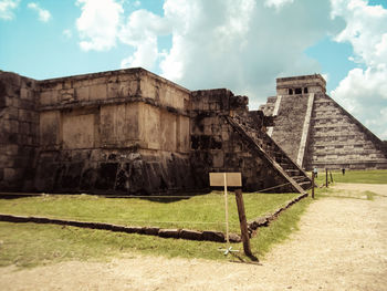 Old ruin building against cloudy sky