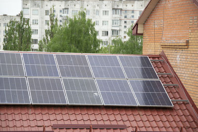 Installing a solar cell on a roof.