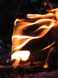 Close-up of fire burning in the dark