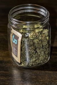 High angle view of glass jar on table