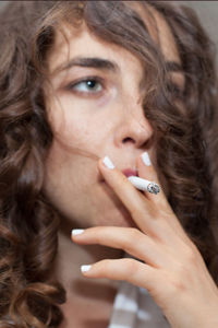 Close-up of woman smoking cigarette