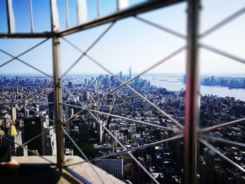 View of suspension bridge through city