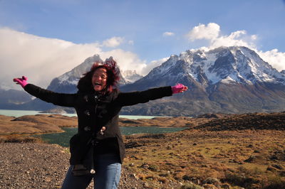 Full length of man standing on mountain against sky