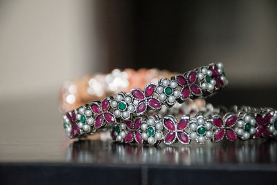 Close-up of wedding rings on table