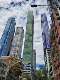 Low angle view of modern buildings against sky in city