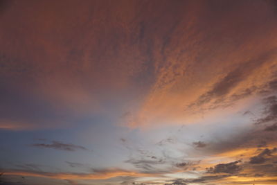 Low angle view of dramatic sky during sunset