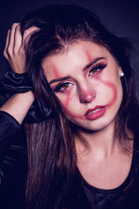 Portrait of beautiful young woman wearing make-up