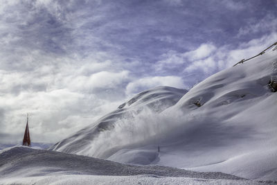 Snow covered mountain against sky