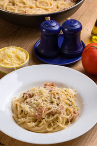 High angle view of carbonara in plate on table