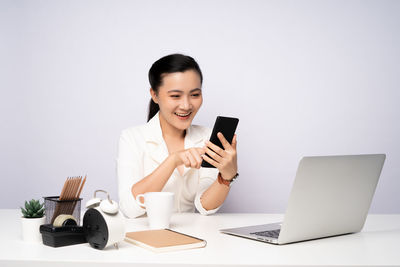 Young woman using mobile phone