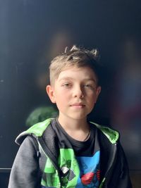 Portrait of boy standing outdoors